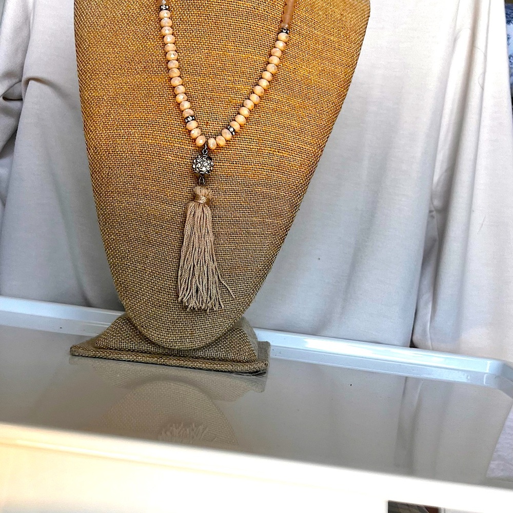 Dressy 22” salmon/grey colored faceted beads. Includes six rhinestone spacers
